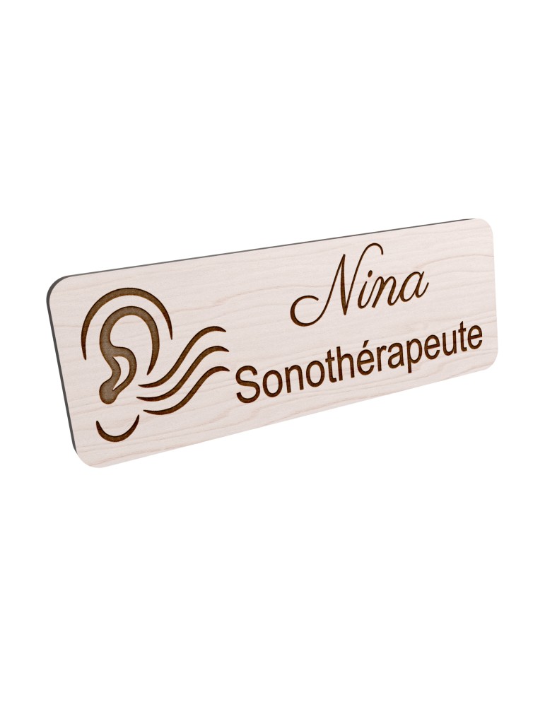 Badge personnalisé sonothérapeute, motif sonothérapie et vibrations sonores, vue en biais